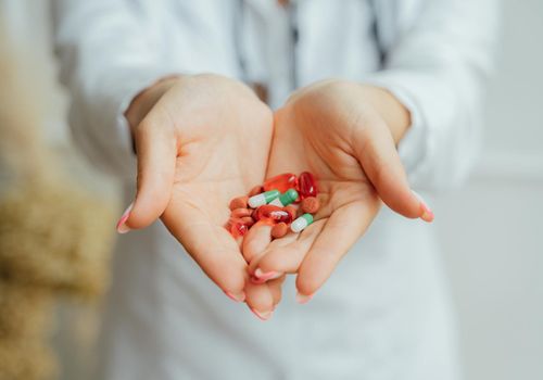 Close-up on a person's hands during an exercise, showing concentration.